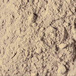 Close-up of beige powder with a textured surface