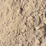 Close-up of beige powder with a textured surface