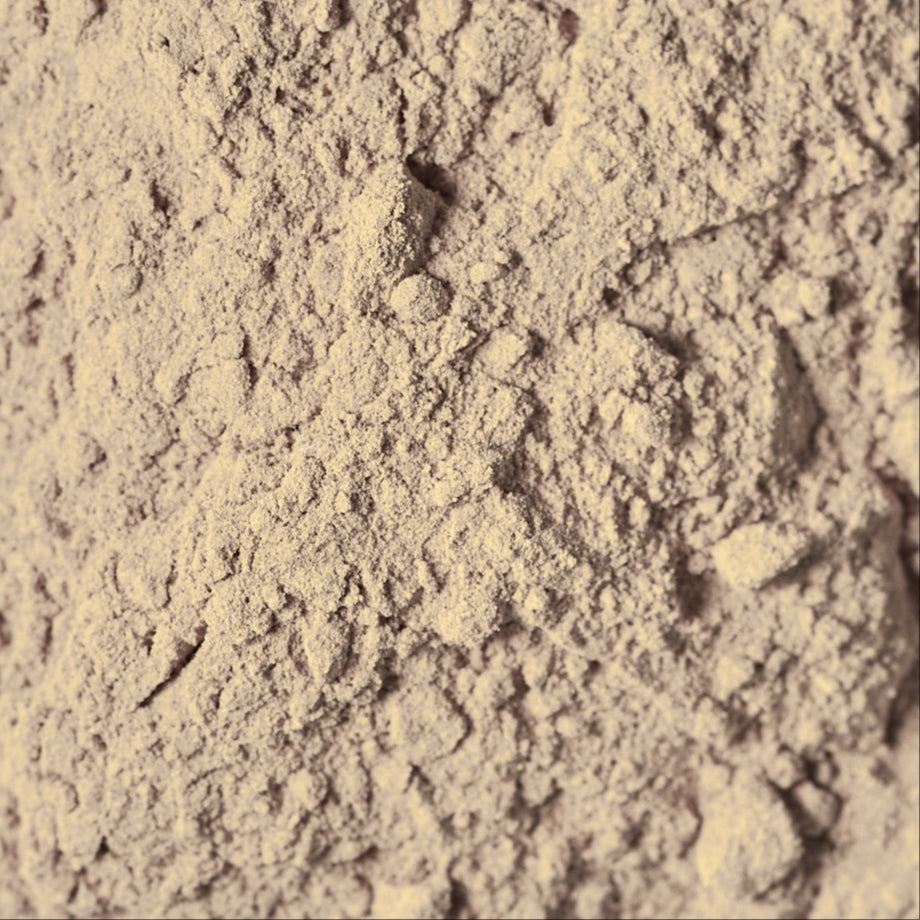 Close-up of beige powder with a textured surface